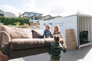 Family loading a BigSteelBox moving container