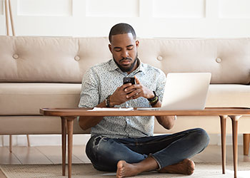 Man testing wifi after moving