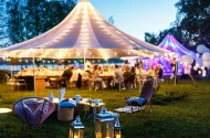 Tent and guests at an outdoor event.