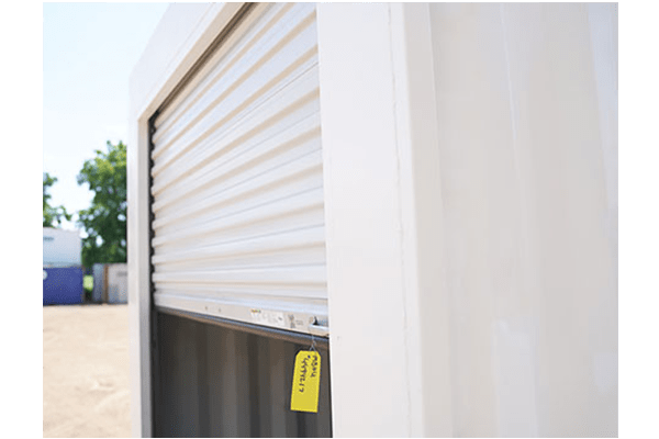 Close up view of a roll up door in a modified shipping container - BigSteelBox