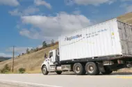 BigSteelBox truck transporting a storage container