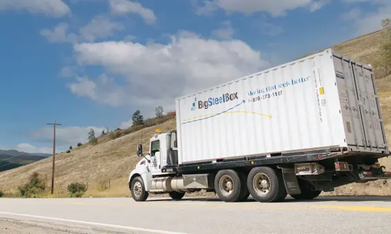 BigSteelBox truck transporting a storage container