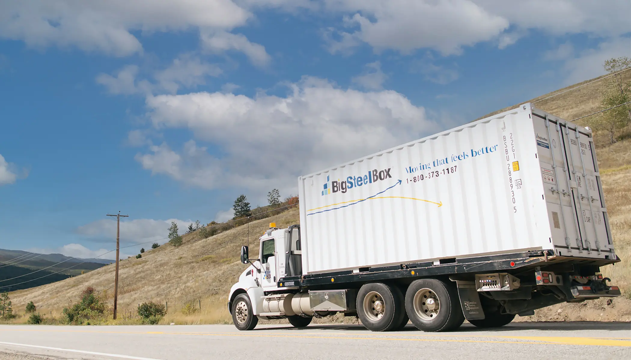 BigSteelBox truck transporting a storage container