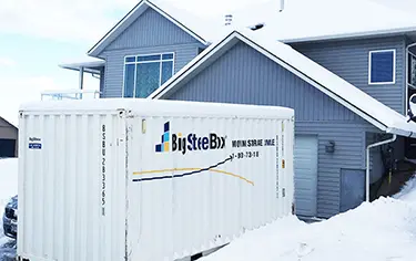 BigSteelBox in a driveway for a move in the winter