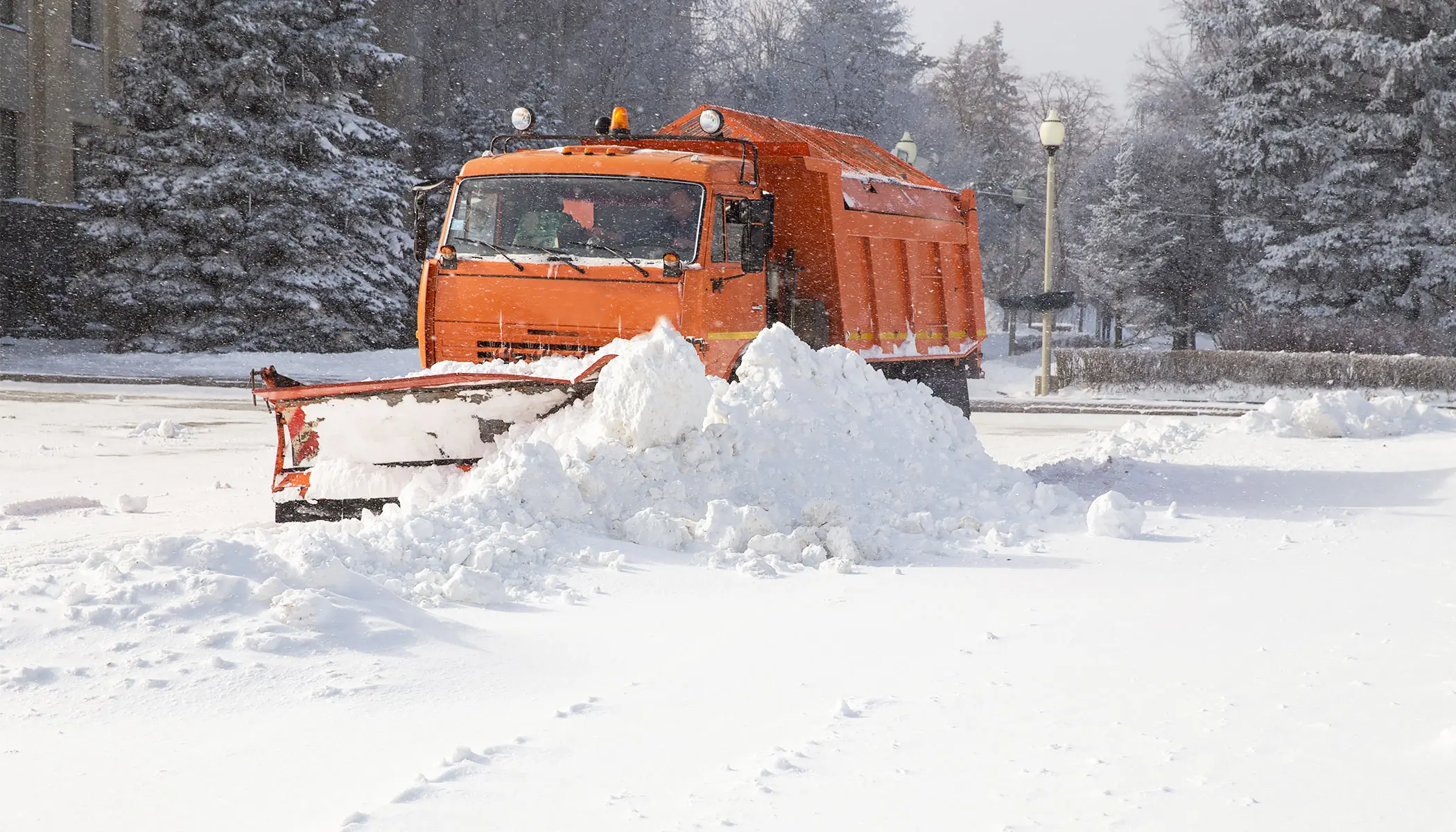 Truck plowing snow - winter moving tips