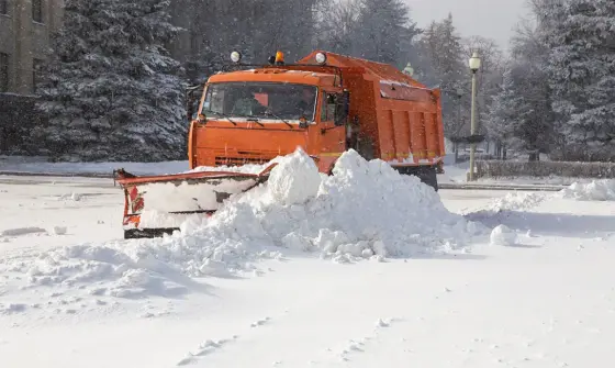 Truck plowing snow - winter moving tips